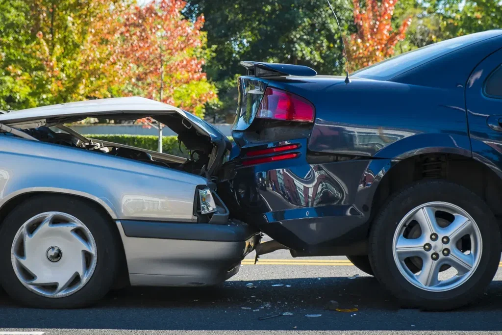 A rear-end car accident collision.