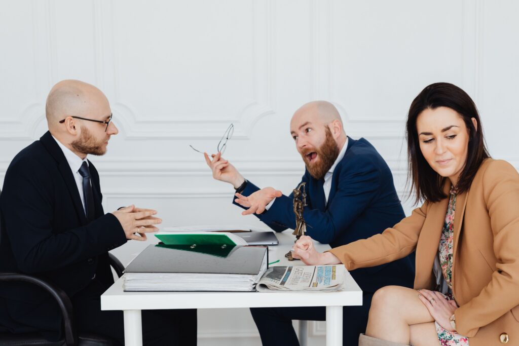 Lawyers Arguing A client shouting at a lawyer, illustrating the answer to the question: “Can a personal injury lawyer drop your case?”. Yes.