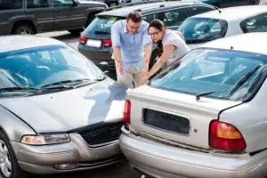 Two drivers argue over who is at fault after a parking lot accident.